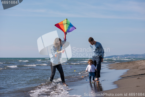 Image of happy family enjoying vecation during autumn day