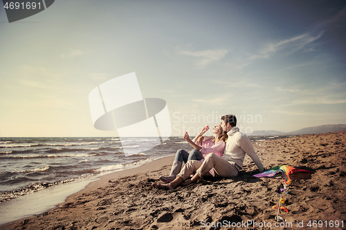 Image of young couple enjoying time together at beach