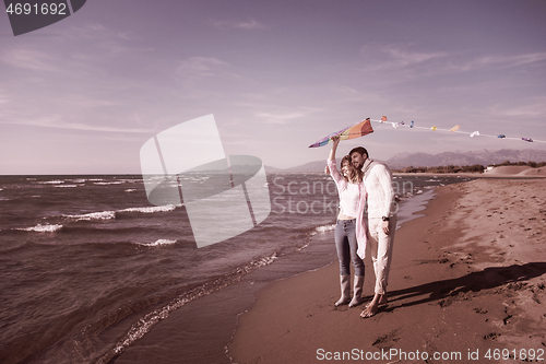 Image of Couple enjoying time together at beach