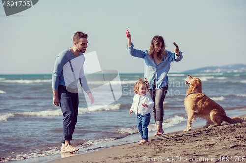 Image of happy young family enjoying vecation during autumn day