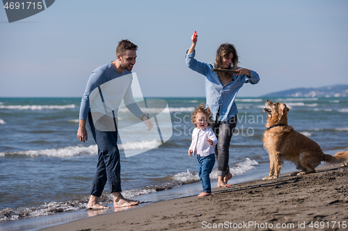 Image of happy young family enjoying vecation during autumn day