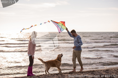 Image of happy couple enjoying time together at beach