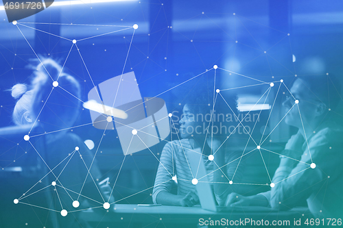Image of Multiethnic startup business team in night office