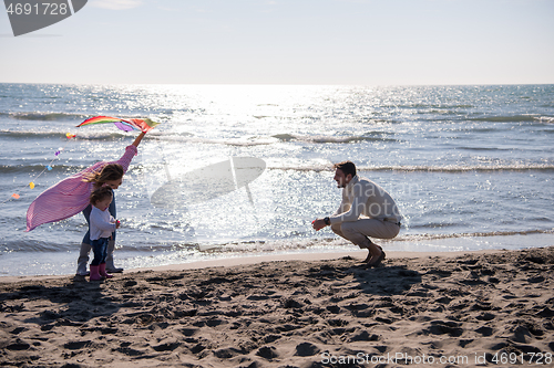 Image of happy family enjoying vecation during autumn day