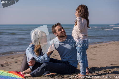 Image of happy family enjoying vecation during autumn day