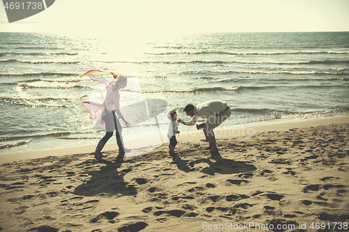 Image of happy family enjoying vecation during autumn day