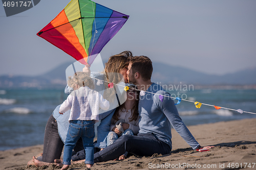 Image of happy family enjoying vecation during autumn day