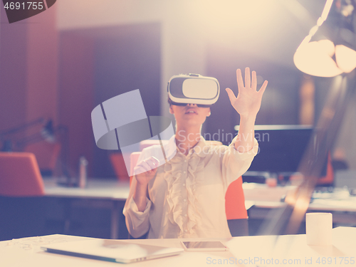 Image of businesswoman using VR-headset glasses of virtual reality