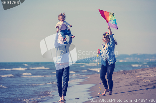 Image of happy family enjoying vecation during autumn day