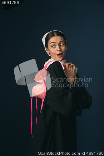 Image of Medieval young woman as a nun with bra