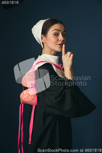 Image of Medieval young woman as a nun with bra