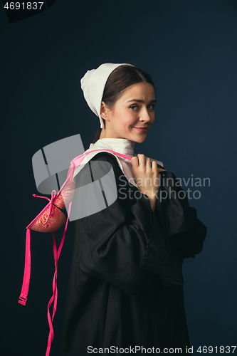 Image of Medieval young woman as a nun with bra