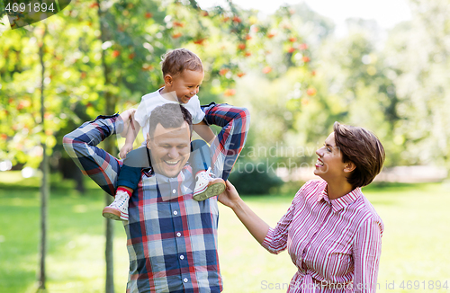 Image of happy family having fun at summer park