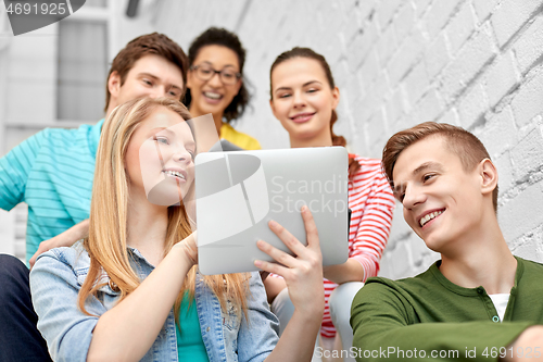 Image of high school students with tablet computers