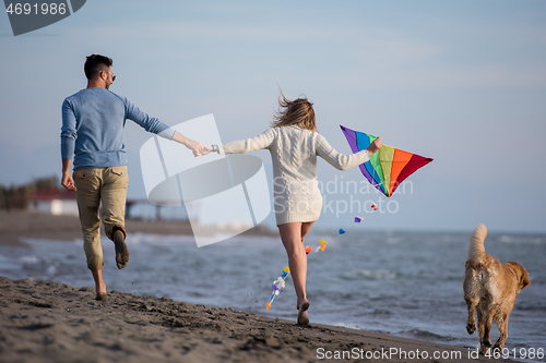 Image of happy couple enjoying time together at beach