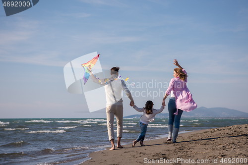 Image of happy family enjoying vecation during autumn day