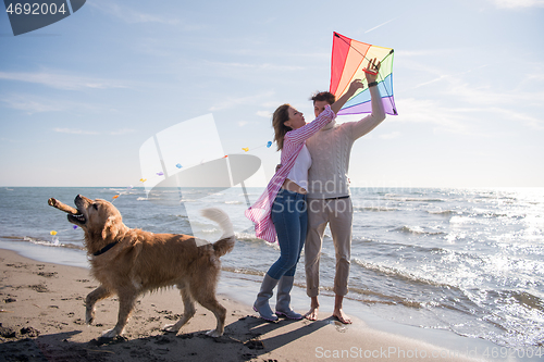 Image of happy couple enjoying time together at beach