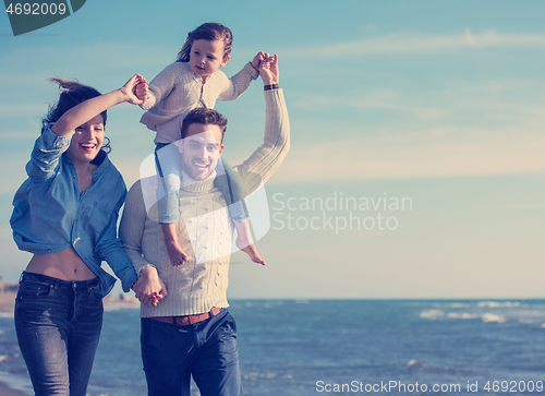 Image of Young family enjoying vecation during autumn