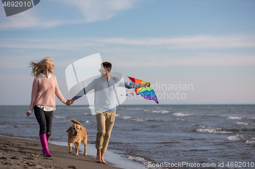 Image of happy couple enjoying time together at beach