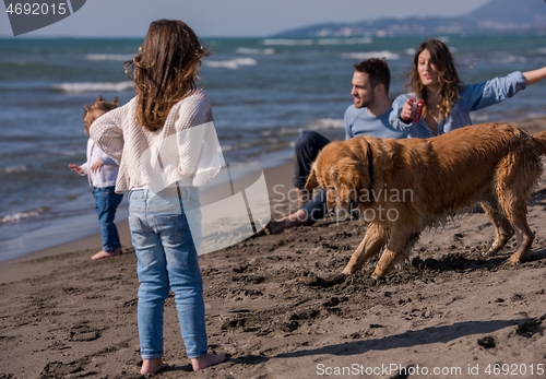 Image of happy young family enjoying vecation during autumn day