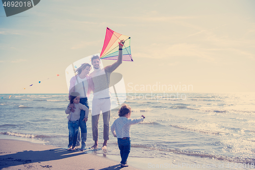 Image of happy family enjoying vecation during autumn day