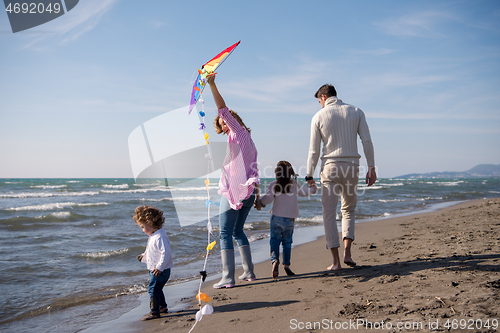 Image of happy family enjoying vecation during autumn day