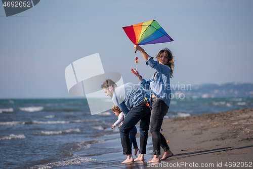 Image of happy family enjoying vecation during autumn day