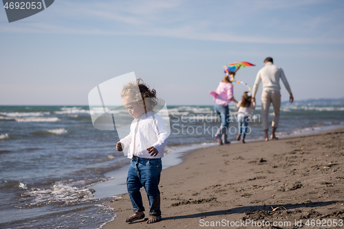 Image of happy family enjoying vecation during autumn day