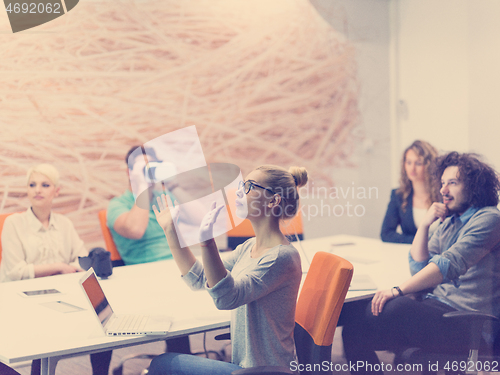 Image of startup business team using virtual reality headset