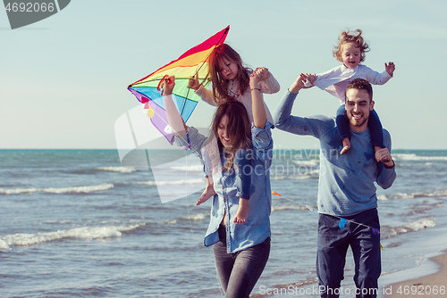 Image of happy family enjoying vecation during autumn day