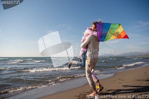 Image of Couple enjoying time together at beach