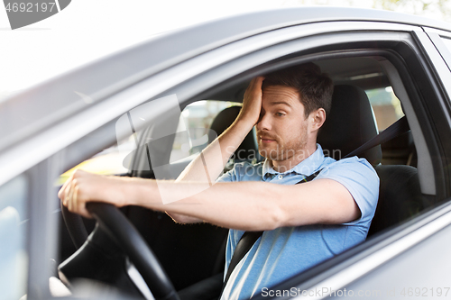 Image of tired sleepy man or driver driving car