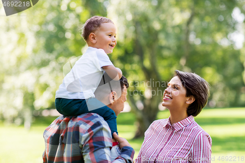 Image of happy family having fun at summer park