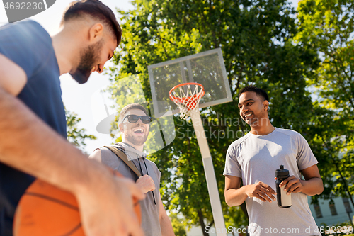 Image of group of male friends going to play basketball