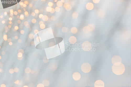 Image of christmas garland lights over grey background