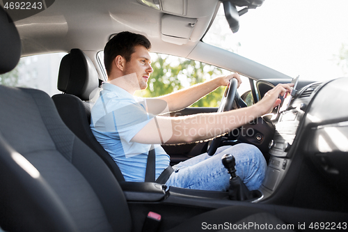 Image of man or driver driving car and using gps navigator