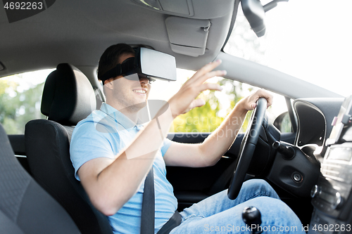 Image of man or driver wearing vr glasses and driving car