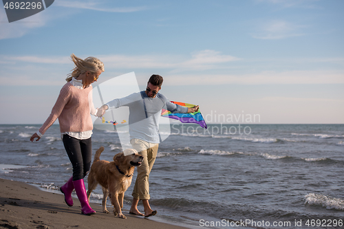 Image of happy couple enjoying time together at beach