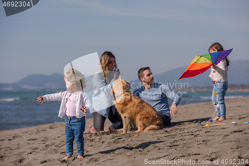 Image of happy young family enjoying vecation during autumn day