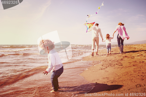 Image of happy family enjoying vecation during autumn day