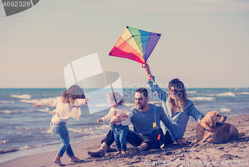 Image of happy young family enjoying vecation during autumn day