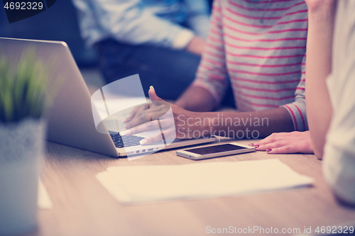 Image of Multiethnic startup business team in night office