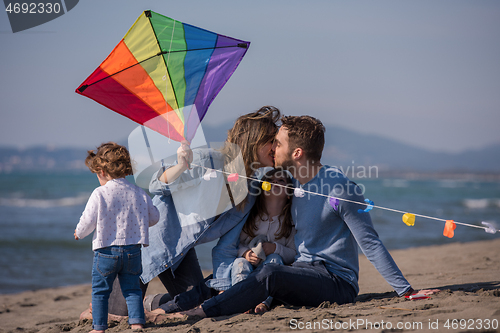 Image of happy family enjoying vecation during autumn day