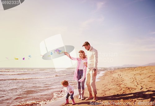 Image of happy family enjoying vecation during autumn day