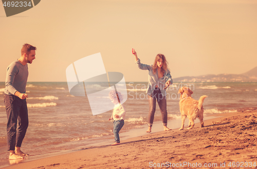 Image of happy young family enjoying vecation during autumn day