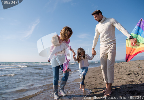 Image of happy family enjoying vecation during autumn day