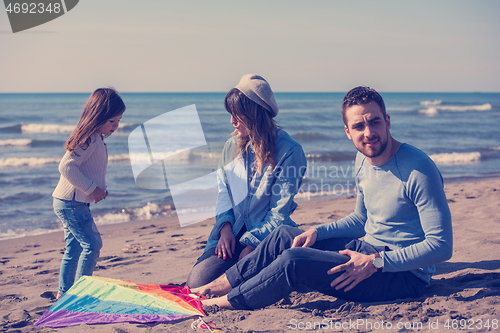 Image of happy family enjoying vecation during autumn day