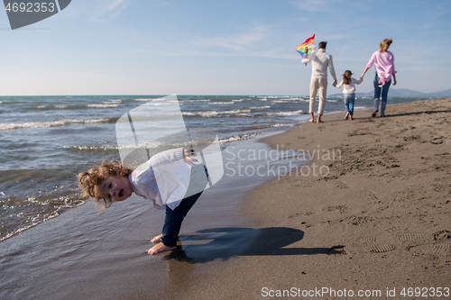Image of happy family enjoying vecation during autumn day