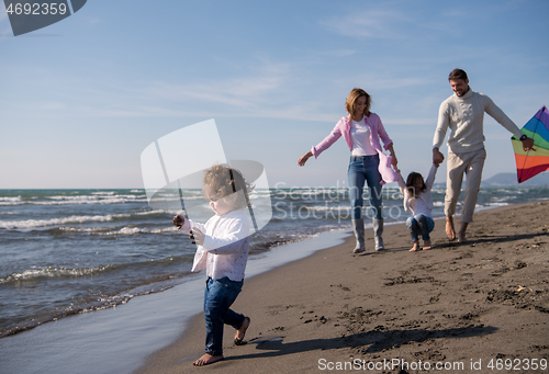 Image of happy family enjoying vecation during autumn day