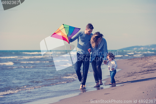 Image of happy family enjoying vecation during autumn day